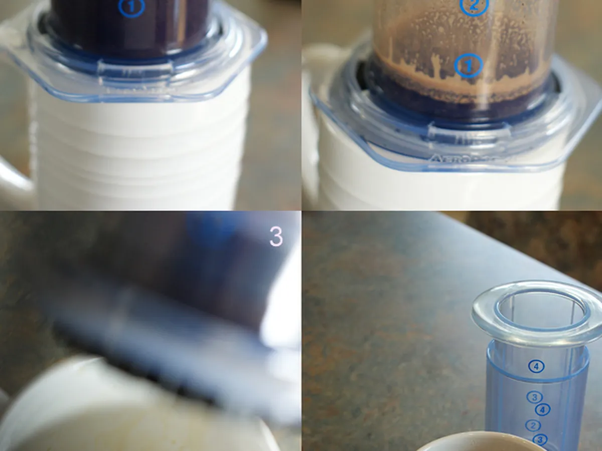 AeroPress manual coffee press being used to brew into a cup